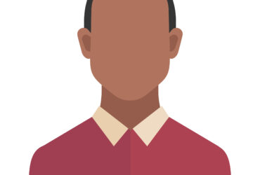 A man wearing a red shirt with a white collar.